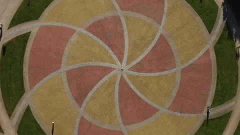 Aerial Top Down View Rotating under Colourfull Brick Park Stock Footage 308858638