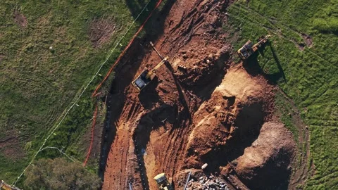 Aerial top down view of a rotating construction site with excavators Stock Footage 341252511