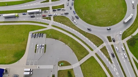 Aerial top-down view of a roundabout traffic crash involving a car with a Stock Footage 340920041
