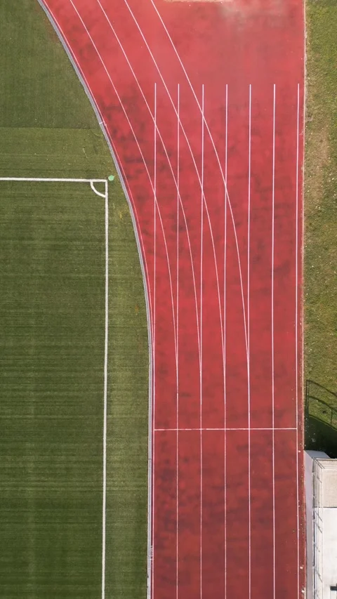 Aerial Top Down View of Running Track and Soccer Field Corner Video stock 331304596