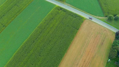 Aerial Top Down View of Rural Farmland in Pennsylvania with Truck Driving 動画素材 116011746