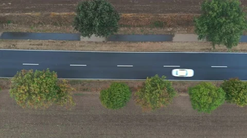 Aerial Top Down View Rural on German Village Street with Passing Cars Stock Footage 135874729