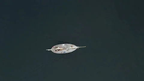 Aerial top down view of sailing boat, during calm seas Stock Footage 143037577