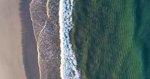 Aerial top down view of sandy beach and green ocean waves The Concept of Su.. Stock-Footage 327872993