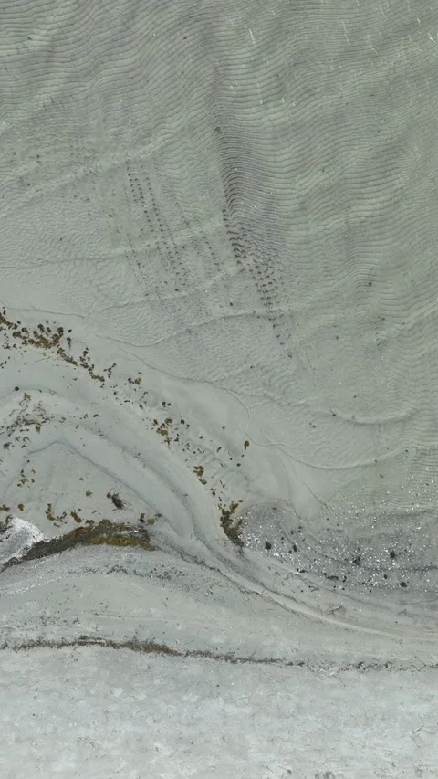Aerial Top Down View of Sandy Beach Shoreline with Ripples Stock Footage 342251425