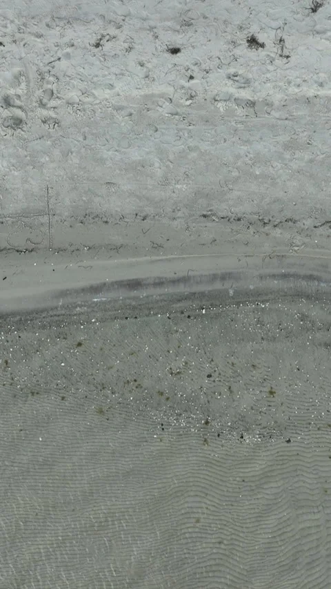 Aerial Top Down View Of Sandy Beach Shoreline And Clear Water Stock Footage 342289740