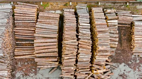Aerial top-down view of sawmill yard full of stacked tree logs Stock Footage 247160104