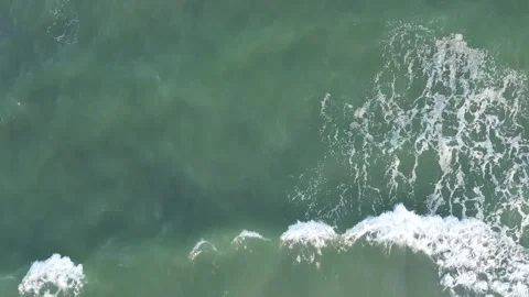 Aerial top-down view of sea waves in Warnemünde, Germany – March 26, 2023 Stock Footage 313123353