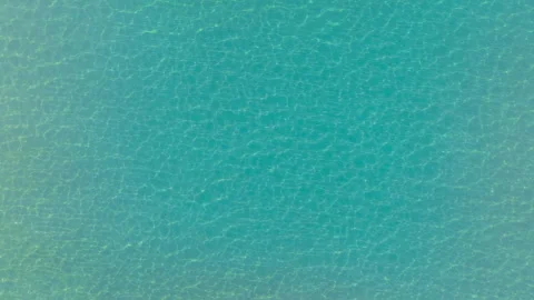 Aerial top-down view of serene sea gradient and beach Stock Footage 263929596