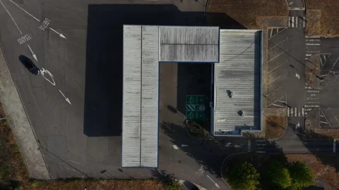 Aerial - Top Down View of Service Station Canopy Roof and Empty Forecourt Stock Footage 343704406