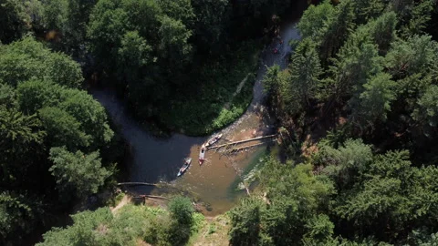 Aerial top down View several canoes kayaks rafting forest river with obstacles Stock Footage 230419627