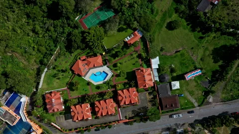 Aerial top down view of a several modern houses and a swimming pool Vidéo 234958792