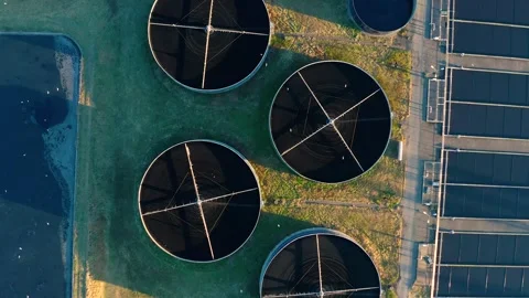 Aerial top down view of sewage treatment plant. Industrial water treatment with Stock Footage 260738644