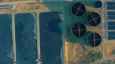 Aerial top down view of sewage treatment plant. Industrial water treatment with Stock Footage 260738746