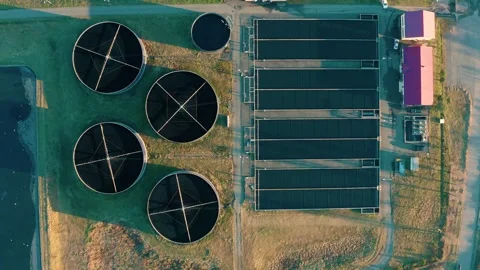 Aerial top down view of sewage treatment plant. Industrial water treatment with Stock Footage 261748965