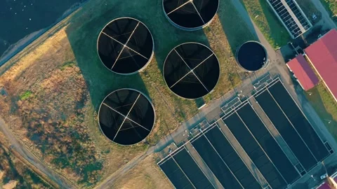 Aerial top down view of sewage treatment plant. Industrial water treatment with Stock Footage 261749097