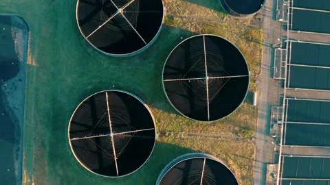 Aerial top down view of sewage treatment plant. Industrial water treatment with Stock Footage 279643602