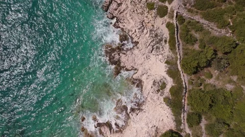 Aerial top down view of shining Adriatic coastline with pine trees Croatia 動画素材 337183307