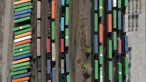 Aerial top down view of shipping containers on train cars at a railroad yard. Stock-Footage 221537908