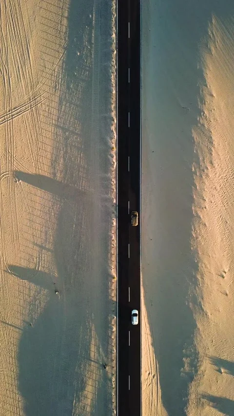 Aerial top-down view showing cars driving along a straight asphalt road that Stock Footage 344820452