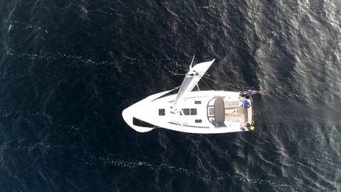 Aerial top down view of sloop is a sailing boat with a single mast 4k Stock Footage 101108399