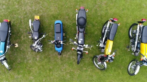 Aerial top down view slow and steady flight over classic mopeds 4k Stock Footage 91332272