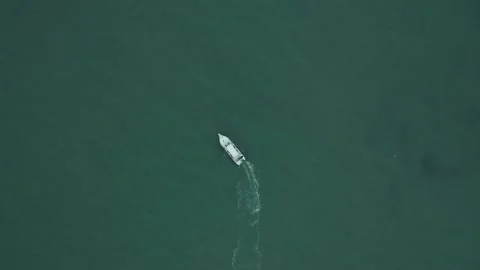 Aerial top down view of a small boat in the ocean Stock Footage 146342054
