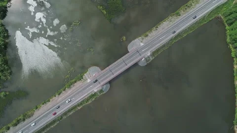 Aerial top down view of small road bridge across the river in rural area. Many Stock Footage 196297442