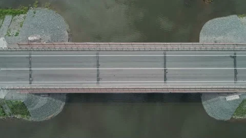 Aerial top down view of small road bridge across the river in rural area. Cars Stock Footage 196297796