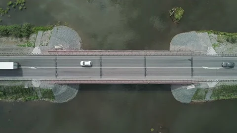 Aerial top down view of small road bridge across the river in rural area. Many Stock-Footage 196297959