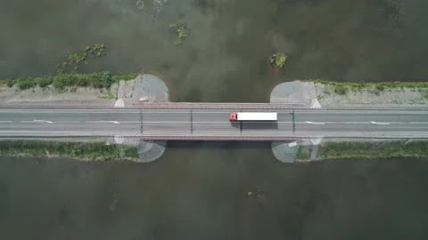 Aerial top down view of small road bridge across the river in rural area. Many Stock-Footage 196298090