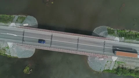 Aerial top down view of small road bridge across the river in rural area. Many Stock Footage 196299156