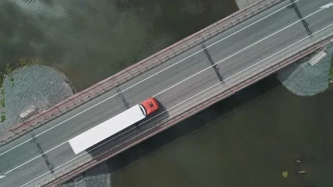 Aerial top down view of small road bridge across the river in rural area. Lorry Stock Footage 196299242