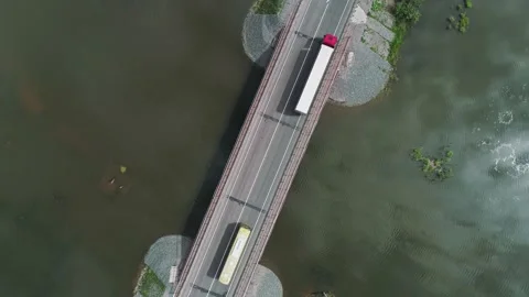Aerial top down view of small road bridge across the river in rural area. Many Video stock 196299646