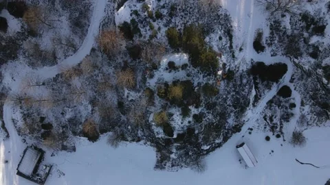 Aerial top down view of a snow covered golf course one sunny day. Stock Footage 148045554