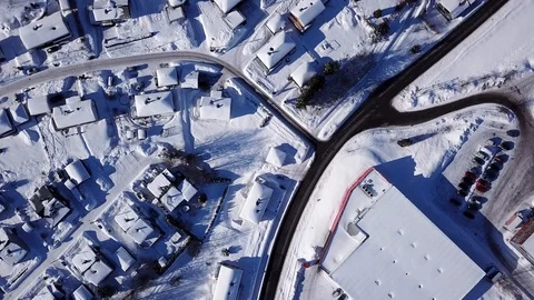 Aerial top down view on snowy highway e18 and houses covered with snow in Norway Stock Footage 86285466