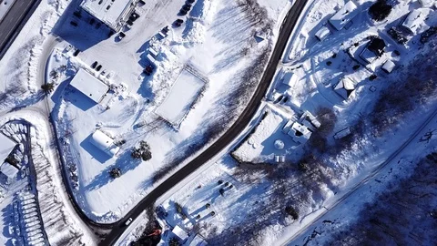 Aerial top down view on snowy highway e18 and houses covered with snow in Norway 스톡 동영상 86286209