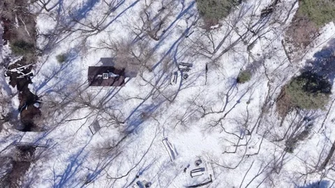 Aerial top down view of snowy park and picnic area in Millcreek Canyon Utah Stock Footage 333881615