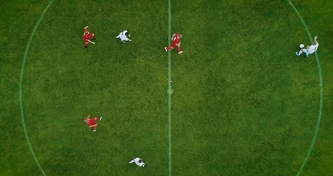 Aerial Top Down View of Soccer Field and Two Professional Teams Playing. Stock Footage