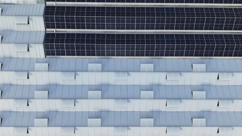Aerial top down view of solar panels and windows on a large greenhouse roof Видео 338030619