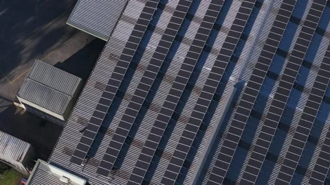 Aerial top down view of solar panels on warehouse roof Stock Footage 341238382
