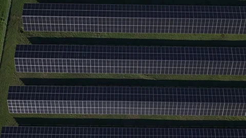Aerial top-down view of solar panel farm on green field Stock Footage 341269393