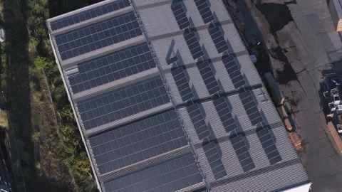 Aerial top down view of solar panels on a factory roof Stock Footage 346385461