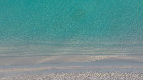 Aerial top-down view of sparkling sea textures at the beach Stock Footage 263679777