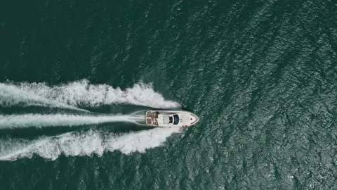Aerial top down view of speed motor boat on open sea at summer day Stock Footage 200200877