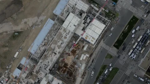 Aerial top-down view of spinning crane over urban construction site, Paris Stock Footage 304035607