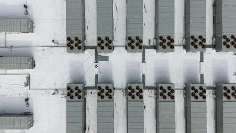 Aerial top down view of spinning hvac fans on a rooftop Video stock 340503279