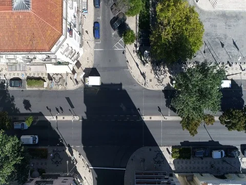 Aerial top down view of street crossing looking down showing pedestrians 4k Stock Footage 80289597