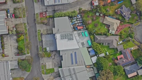 Aerial top down view of suburban residential and industrial zone Stock Footage 340594145