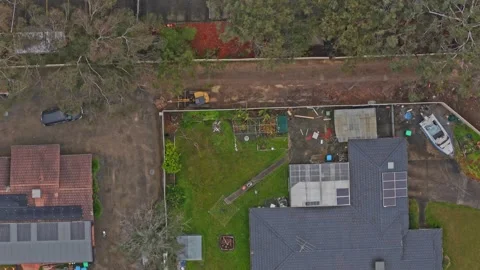 Aerial top down view of suburban neighborhood with an excavator Stock Footage 340594410